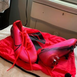 Hot pink Nike cleats